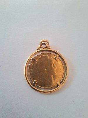 a close up of a coin on a white surface