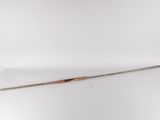 an old wooden stick with a wooden handle sitting on a white surface