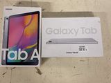 a box of samsung tab a with the box open next to it