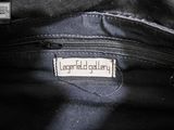 an image of a close up of a black bag with a label on it