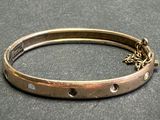 an image of a close up of a bracelet on a table