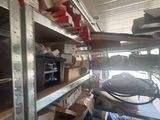 a room with a lot of shelves and boxes on it