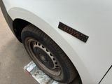 a close up of a car tire with a sticker on it