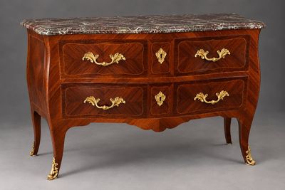 an antique chest of drawers with marble top