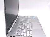 a silver laptop computer sitting on a white surface