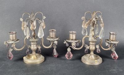 three antique brass candelabs with crystal drops on each of them
