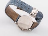an image of a close up of a wrist watch on a white surface