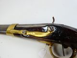 a gun that is on display on a table