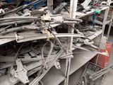 a large pile of metal items in a warehouse