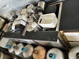 many different types of propane gas tanks on this shelf