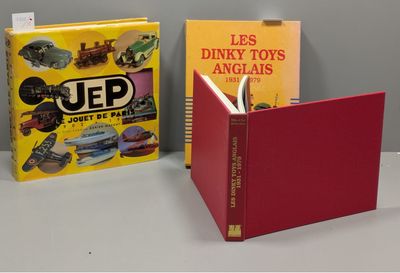 two books sitting on a table next to each other on a table