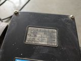 a close up of a motorcycle with a number plate on it