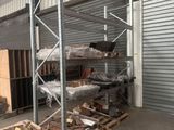 a large warehouse with a lot of wood on the floor