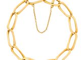 a close up of a gold chain bracelet on a white background