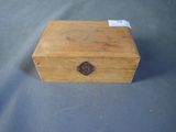 an old wooden box sitting on top of a blue surface