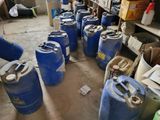 many blue barrels lined up in a room