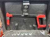 a tool box with tools inside of it on a table
