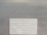 a plaque on the side of a silver refrigerator