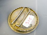 a small metal object with a tag attached to it