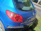 a blue car that is parked on the side of the road