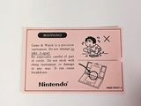 a sticker on the back of a nintendo wii game