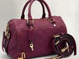 Sac « Louis Vu Vu » en cuir bordeaux avec des finitions dorées