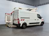 a white van with a ladder on the back of it