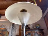 a lamp that is hanging from the ceiling in a room