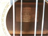 a close up of a guitar with a label on it