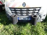 a picture of a car that is parked in the grass