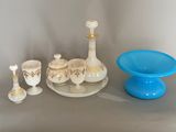a table with a blue plate and a blue bowl and a blue bowl and a blue bowl and a blue bowl and a blue bowl and a blue bowl