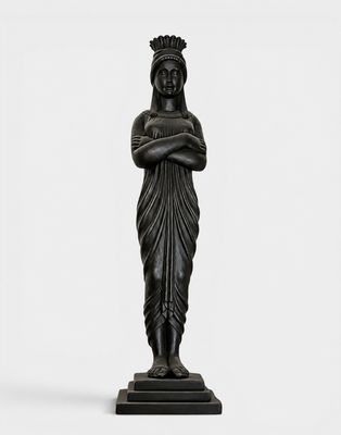 a black statue of a woman with a crown on her head
