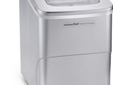 a close up of a small ice cream maker with a scoop of ice