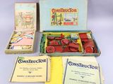a box of construction books and a box of construction kits