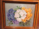 a painting of a bunch of flowers in a wooden frame