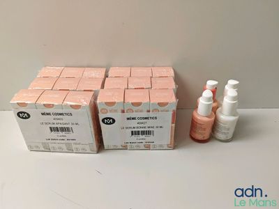 two boxes of hand sanitizer and a bottle of hand sanitizer on a table
