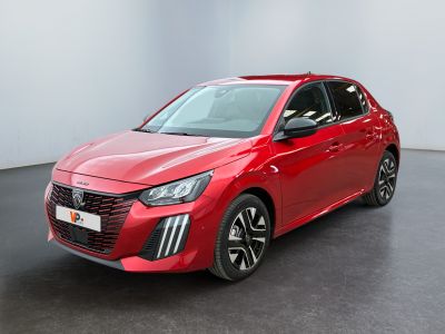 a red car is parked in a room with a white wall