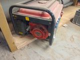 a small generator that is sitting on a pallet