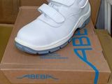 a box with a pair of white shoes on top of it