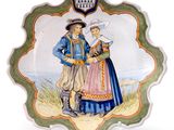 a plate with a picture of a man and a woman on it