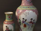 two vases sitting next to each other on a table