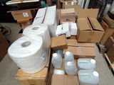 a lot of boxes and containers on a pallet in a warehouse