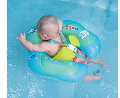 a baby that is floating in the water on a raft