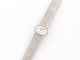 an image of a silver watch on a white surface with a white background