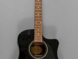 an image of a black acoustic guitar sitting on top of a white wall