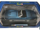 the box is open to show a blue toy car in it ' s packaging