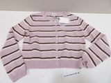 pink and brown striped cardigan sweater sitting on a white table