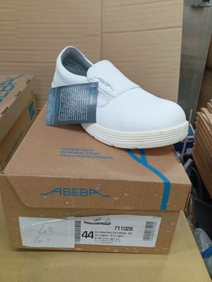 a box with a pair of white shoes on top of it