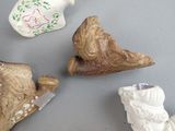 three figurines that are sitting on a table