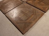 four pieces of wood sitting on the floor of a room